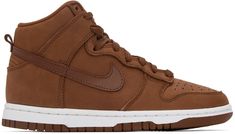 High-top nubuck sneakers in brown. Buffed leather trim throughout. · Perforated detailing at round toe · Lace-up closure · Textile logo patch at padded tongue · Padded collar · Swoosh appliqué at sides · Pull-loop at heel · Treaded rubber sole Please note that this item may be shipped only within North America. Supplier color: Pecan/Pecan-white Brown Lace-up Skate Shoes For Streetwear, Brown Skate Shoes For Streetwear, Brown Urban Sneakers For Streetwear, Urban Brown Sneakers For Streetwear, Nike Casual High-top Sneakers For Streetwear, Brown Suede High-top Sneakers, Brown Lace-up Skate Shoes With Gum Sole, Suede High-top Sneakers With Perforated Toe Box For Streetwear, High-top Sneakers With Embossed Logo