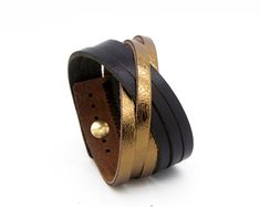 The simple design of this cuff bracelet allows the natural beauty of its rich and hearty leather to come through. Not to mention just the right touch of metallic shine!Made with a heavy cowhide leather bracelet and features an adjustable metal stud closure. Nickel-free. Fits wrists 15.5 cm – 18cm / 6" - 7 1/2" (measure wrist from point to point with no overlap) and is 3.5 cm (1 3/8") wide.View all our colour options: https://www.etsy.com/ca/shop/Rimanchik/search?search_query=orleans&order=date_d Adjustable Leather Bracelet With Gold Clasp, Elegant Leather Bracelet With Gold Clasp, Yellow Gold Leather Bracelet Gift, Yellow Gold Leather Bracelet As Gift, Yellow Gold Leather Bracelets For Gift, Adjustable Yellow Gold Leather Bracelet, Luxury Gold Leather Bracelet With Adjustable Fit, Luxury Gold Leather Bracelet Adjustable, Luxury Gold Adjustable Leather Bracelet