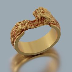 a gold wedding ring with an animal design