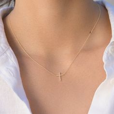 Our cross necklace is handcrafted in 18-karat yellow gold set with pave diamonds and fixed to a 16" delicate link chain. A traditional religious symbol, it's a sweet gift for yourself or someone special. Fixed to a 16 inch, 14-karat link chain Pendant measures approximately 0.5" x 0.4" Spring ring clasp Made with love in Los Angeles Complimentary gift wrapping provided Diamond Cross Necklace, Religious Symbols, Gold Cross Necklace, Yellow Gold Setting, Diamond Cross, Christian Jewelry, Gold Cross, Chain Pendant, Simple Jewelry