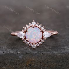 This is a Vintage Engagement ring set with White Opal and Cubic Zircon. This ring is marked S925 Main stone is 7mm Round Cut Lab created White fire Opal, side stones are cubic zirconia. Best Gift for Engagement,wedding,birthday gift. I accept custom making order.Please contact me if you need this service. All the jewelry in my store is handmade.It may take 2-3 weeks to finish. For all the jewelries,there is a 14 days money back guarantee.You can return it in the time frame without any questions. Rose Gold Sterling Silver Opal Ring For Wedding, Wedding Rose Gold Opal Ring In Sterling Silver, Citrine Wedding Band, White Opal Engagement Ring, Vintage Opal Ring, Citrine Wedding, Opal Wedding Ring, Vintage Engagement Ring Settings, Engagement Ring Round Cut