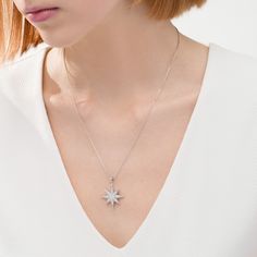 A beacon of style, this diamond pendant emits beguiling beauty. Created in sterling silver, this dazzling design showcases a sculpted eight-pointed star dangle sparkling with diamonds. Radiant with 1/2 ct. t.w. of diamonds and a bright polished shine, this pendant suspends along an 18.0-inch box chain that secures with a spring-ring clasp. Elegant Silver Jewelry With Star Charm, Silver Star-shaped Diamond Necklace, Silver Star-shaped Diamond Necklace With Accents, Elegant White Gold Star Diamond Necklace, Silver Diamond Star Necklace, Elegant Star-shaped White Gold Diamond Necklace, Elegant Star Shaped White Gold Diamond Necklace, Elegant Starburst Jewelry For Anniversary, Sparkling Silver Starburst Jewelry