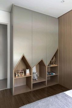 a room with some shelves in it and a stuffed animal on the floor next to them