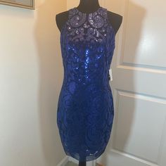 Navy Jersey High Neck Sleeveless Sequined Cocktail/Party Dress. Full Back Zipper; Double Ended, Will Zip Completely Open. Lined. 100% Polyester. Royal Blue Sleeveless Dress For Night Out, Royal Blue Sleeveless Evening Mini Dress, Royal Blue Sleeveless Sequin Dress, Royal Blue Sleeveless Dress With Sequins, Royal Blue Sleeveless Mini Dress For Cocktail, Royal Blue Sleeveless Mini Dress For Evening, Royal Blue Sleeveless Cocktail Mini Dress, Blue Sleeveless Dress For Party Season, Glamorous Sleeveless Blue Dress