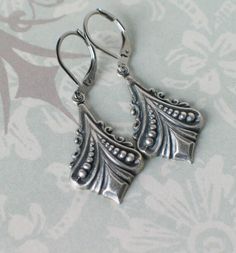 "These beautiful Art Deco silver plated brass earrings are reminiscent of Downton Abbey and designs from the 1920s and 1930s. They hang from stainless steel leverback earwires and hang 1 3/4\" long. Comes in a lovely gift box with ribbon." Antique Silver Antique Style Earrings For Gift, Vintage Sterling Silver Jewelry For Vintage Events, Sterling Silver Vintage Jewelry For Vintage Events, Handmade Antique Silver Vintage Earrings, Sterling Silver Vintage Jewelry For Events, Nickel-free Art Nouveau Earrings As Gift, Handmade Vintage Antique Silver Earrings, Antique Silver Vintage Drop Earrings, Vintage Antique Silver Dangle Earrings