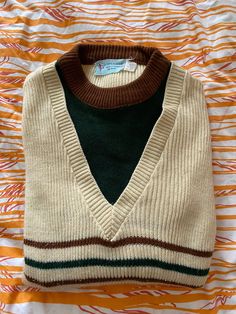 Vintage 1970s-era Keen Man knit tennis sweater - cream, with green and brown accents. "Men's" size medium.  Made in Korea, 100% acrylic.  Pre-owned but great condition!  Perfect for those preppy vibes! Retro Green Cotton Sweater, Retro Cotton Beige Sweater, Retro Beige Cotton Sweater, Retro Fall Sweater, Cream Retro Winter Sweater, Retro Green Sweater Vest For Winter, Retro Cream Crew Neck Sweater, Retro Crew Neck Cream Sweater, Retro Crew Neck Sweater Vest For Fall