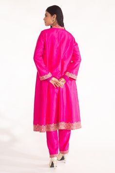 Magenta pink A-line kurta featuring zardozi hand embroidery on the neckline, sleeve and ghera hem. Paired with a straight pant. - Aza Fashions Pink Chanderi Sherwani For Wedding, Pink Chanderi Sherwani With Zari Work, Pink Chanderi Sherwani With Resham Embroidery, Pink Anarkali Style Sherwani For Festive, Pink Anarkali Sherwani For Festive Occasions, Pink Anarkali Sherwani For Festive Season, Festive Pink Chanderi Sherwani, Pink Silk Palazzo Set With Intricate Embroidery, Pink Embroidered Raw Silk Palazzo Set