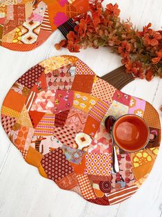 an orange plate and cup on a white table