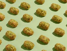 several balls of food sitting on top of a green surface