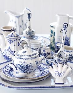 a blue and white china set on a table