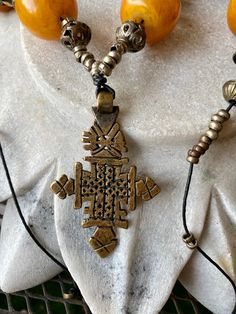 Bold Copal Amber Resien Ethiopian Cross Vintage Necklace necklace measures aprox 28 inches around Ethiopian Necklace, Ethiopian Cross, Antique Rings Vintage, Usa Jewelry, Charm Necklaces, Sterling Silver Filigree, Antique Necklace, Necklace Necklace, Handcrafted Necklace