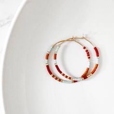 Ultra lightweight hoop earrings beaded in colorful summer styles! Available in your choice of Sterling Silver or 14k Gold Fill. The perfect fun + flirty statement earrings. • Hoops measure 30mm • Earrings are Sterling Silver or 14k Gold Filled. No plating. • 100% hypoallergenic, waterproof and tarnish resistant Hypoallergenic Small Hoop Earrings For Summer, Minimalist Hypoallergenic Hoop Earrings For Summer, Trendy Hypoallergenic Hoop Earrings For Summer, Trendy Hypoallergenic Summer Hoop Earrings, Trendy Summer Hypoallergenic Hoop Earrings, Summer Minimalist Hypoallergenic Hoop Earrings, Trendy Hoop Earrings With Tiny Beads, Modern Hoop Earrings Summer Gift, Modern Summer Hoop Earrings As A Gift