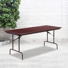 PRICES MAY VARY. Does your client want the visual impact of elegant long tables for their special event? If so, this folding table is just what you need. Use this versatile table at home for holiday dinners and family reunions or at your school's bake sale. .875" thick high pressure laminate mahogany finish top with black T-mold edge band 18 gauge steel brown powder coated pedestal legs hold up to 551 lbs. weight capacity Contemporary folding banquet table designed for commercial use PRODUCT MEA Catering Table, Wood Folding Table, Banquet Table, Folding Furniture, Banquet Tables, Under The Table, Table Seating, Save The Day, Mahogany Wood