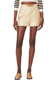 Sitting high on the waist, this pair of gold-tone tailored shorts from Valentino are detailed with the brand's signature VLogo signature logo plaque to the front. Crafted with a touch of silk, they feature a concealed side zip fastening and two inseam side pockets.Textured finishVLogo SignatureChain-link detailingHigh waistTwo side inset pocketsSide zip fasteningComposition: Polyester 39%, Silk 33%Lining: Viscose 63%, Silk 37%Outer: Metallic Fibre 28%Length from waist 34 cm / 13.3"Leg opening 69 Gold Bottoms With Built-in Shorts For Summer, Elegant Formal Shorts With Short Inseam, Chic Formal Shorts With Short Inseam, Formal Summer Shorts, Formal Shorts For Summer, Luxury Gold Formal Bottoms, Luxury Gold Party Bottoms, Gold Formal Bottoms, Formal High-waisted Shorts For Summer