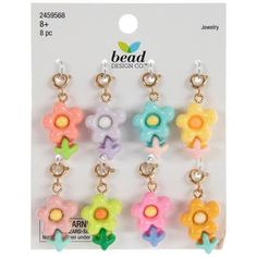 the bead design co flower charms are multicolored