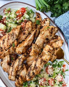 grilled chicken and salad on a white plate