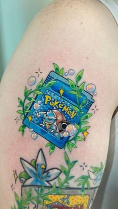 the back of a woman's arm with pokemon tattoos on it and an image of a