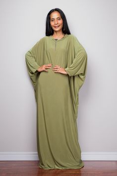 "Olive Green Kaftan Dress, Maxi Dress, Long boho dress, Loose fit dress, Modest dress, Green kaftan with pockets PRODUCT SIZE : One Size Fits Most * Chest : free up to 58\" * Waist : free up to 58\" * Hips : free up to 58\" * Circumference bottom hem : 45\" * Length : 56\" * Sleeve length : 23\" MATERIAL * Spandex Venetia * Zipper on the back MODEL : * Model chest : 32\", Height 160 cm (5.2) without high heel * Accessories excluded Produced by NUICHAN IMPORTANT NOTE *Please note that colours sho Lagenlook Long Green Dress, Green Flowy Maxi Length Kaftan, Green Boho Tunic Dress, Green Flowy Boho Maxi Dress, Green Free Size Tunic Dress, Green Flowy Tunic Maxi Dress, Green Free-size Tunic Dress, Green Casual Maxi Length Kaftan, Green Flowy Long Kaftan