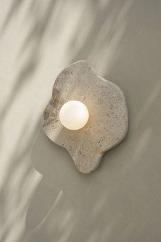 a light that is on the side of a wall in some kind of concrete structure