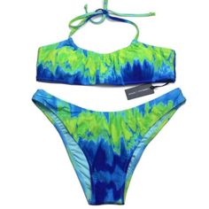 New Kendall + Kylie Bikini. Blue And Green Tie Dye Print. Gathered, Halter Top With Tie. Removable Cups. Ruching At The Back Of The Bottoms. Back Logo Plate On Top And Bottoms. Lined. 82% Nylon. 18% Spandex. Size Xl. Blue Stretch Swimwear For Summer, Stretch Blue Swimwear For Summer, Blue Summer Tankini For Pool, Blue Stretch Beachy Swimwear, Blue Tankini For Vacation Sunbathing, Blue Tankini For Swimming On Vacation, Blue Tankini For Vacation Swimming, Blue Halter Neck Tankini For Beachwear, Spring Bandeau Tankini For Pool