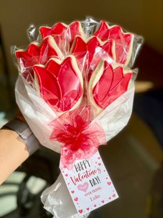 a bouquet of valentine's day cookies wrapped in cellophane