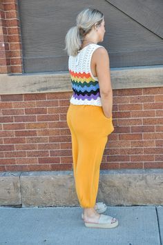 This rainbow crochet sweater tank top radiates joy and vibrancy, perfect for infusing your wardrobe with a playful pop of color. Crafted entirely from 100% acrylic, it offers a lightweight yet cozy feel, making it suitable for layering or wearing on its own. The crochet construction adds texture and visual interest, while the rainbow color palette brings a cheerful and whimsical touch to the piece. Whether you're lounging at a summer festival or enjoying a casual day out with friends, this tank Multicolor Sleeveless Knit Top For Summer, Multicolor Sleeveless Knit Top For Spring, Multicolor Sleeveless Tank Top For Loungewear, Sleeveless Stretch Crochet Top For Fall, Casual Multicolor Knit Sweater Vest, Casual Multicolor Sweater Vest For Spring, Multicolor Knit Tank Top For Summer, Multicolor Knit Tank Top For Spring, Multicolor Knit Sleeveless Tank Top