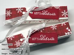 two red and white tags with snowflakes on them are attached to each other