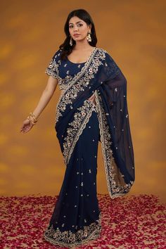 Blue georgette saree with floral pattern hand embroidery. Comes with matching embroidered padded blouse and a petticoat. - Aza Fashions Blue Embroidered Pre-draped Saree For Transitional Season, Anarkali Embroidered Pre-draped Saree In Georgette, Fitted Georgette Embroidered Fabric With Dori Work, Fitted Georgette Fabric With Dori Embroidery, Georgette Fabric With Dori Embroidery, Blue Georgette Blouse Piece With Resham Embroidery, Blue Embroidered Georgette Blouse Piece, Traditional Blue Georgette Pre-draped Saree, Blue Georgette Saree With Sheer Dupatta