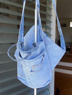 This bag is made from recycled denim and recycled kimono fabric. You can use it whenever you want for shopping, work, school or outings. A size bag: length 29cm x width 35cm Handle: 36cm Strap: 94cm 2 magnetic hooks The pocket is on one side of the front, there is no pocket inside.        B size bag: 28cm long x 35cm wide Strap 92cm 2 magnetic hooks There are pockets on both sides of the front, but no inside. We recommend hand washing. Denim Blue Cotton Tote Shoulder Bag, Rectangular Denim Blue Cotton Shoulder Bag, Denim Travel Bag With Upcycled Material, Upcycled Denim Travel Bag, Blue Recycled Denim Bag For Everyday Use, Blue Recycled Denim Shoulder Bag For Daily Use, Blue Recycled Denim Tote Shoulder Bag, Everyday Denim Blue Recycled Denim Bag, Eco-friendly Denim Blue Denim Bag