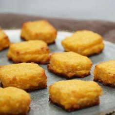 some fried food is on a plate and ready to be eaten by the person in the photo