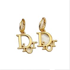 Gold-plated Jewelry With Logo Charm, Luxury White Dangle Hoop Earrings, Luxury Gold Earrings With Logo Charm, Personalized Gold Dangle Earrings, Luxury Metal Earrings For Everyday Wear, Personalized Gold-plated Earrings, Gold Plated Charm Earrings, Gold-plated Charm Earrings, Trendy Personalized Gold Hoop Earrings