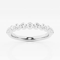 a white gold wedding ring with five diamonds