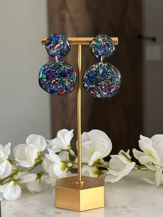 Add a sparkle to your look with these beautiful Bejeweled earrings! Inspired by Taylor Swift's Eras tour, these earrings feature a multicolor glitter mix for a classic look that is sure to turn heads. Rainbow Drop Earrings For Party, Party Multicolor Crystal Earrings, Elegant Rainbow Earrings For Party, Glamorous Multicolor Dangle Crystal Earrings, Nickel Free Crystal Earrings For Party, Glamorous Multicolor Earrings For Gift, Party Multicolor Earrings With Sparkling Stones, Multicolor Crystal Matching Earrings For Party, Party Earrings With Sparkling Multicolor Stones