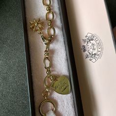 Never Used Juicy Couture Bracelet With Juicy Couture Crown Charm Included Elegant Charm Bracelet With Logo Charm As Gift, Elegant Bracelets With Logo Charm For Gift, Elegant Bracelets With Logo Charm As Gift, Gold-tone Chain Bracelet With Logo Charm As Gift, Gold-tone Bracelet With Logo Charm As Gift, Luxury Charm Bracelet With Logo Charm As Gift, Luxury Logo Charm Bracelet As Gift, Elegant Metal Chain Bracelet With Logo Charm, Elegant Metal Charm Bracelet With Logo Charm