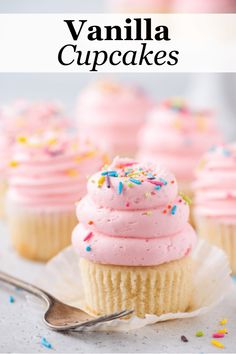 vanilla cupcakes with pink frosting and sprinkles