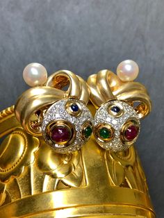 A beautiful and unique pair of earrings hand crafted in 14K satin finished and high polished yellow gold set with approximately 2cttw in G-I color Vs1-2 clarity round diamonds as well as approximately 1cttw cabochon sapphires, 1.50cttw in cabochon emeralds and 3cttw in cabochon rubies and topped with 8.50mm pearls. We have never seen or owned earrings that looked like these and odds are neither have you. The design and execution is just wonderful. Time was absolutely spent on these. Dimensions/W Cabochon Ruby, Yellow Gold Setting, Ruby Sapphire, Gold Set, Wonderful Time, Round Diamonds, Labour Day, Jewelry Earrings Dangle, Etsy Earrings