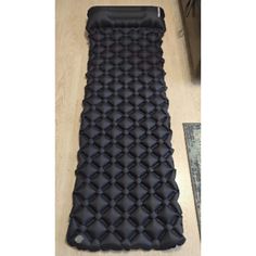 an inflatable sleeping bag on the floor