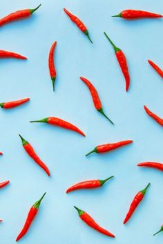 many red peppers on a blue background