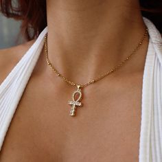 Ankh Necklace, Egyptian Jewelry, Spiritual Jewelry for Her, Meaningful Jewelry, Cubic Zirconia Necklace, Gift for Her, Egyptian Necklace ☽ 24K Gold Plated, Cubic Zirconia Charm (19.7x13.3mm) ☽ This is a gold plated charm meaning that it requires extra care to keep its shine and color intact. Please follow these tips to make the charm last longer in its original condition: avoid wearing it to the beach, pool, shower, bathtub, hot tub; avoid it touching any lotions, creams, or sweat; take it off b Gold Ankh Necklace, Gift Rhinestone Charm Necklaces, Ankh Jewelry, Egyptian Inspired Jewelry, Jewelry Spiritual, Egypt Jewelry, Dope Jewelry Accessories, Shower Bathtub, Egyptian Necklace