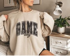 Game Day Sweatshirt, Sports Sweater, Sports Game Day Hoodie, Sports Mom Sweatshirt, Sports Gift, Women Sports, Game Fan Sweatshirt -If you have any inquiries about colors, sizes, or designs, please feel free to reach out to us with a message. -Our order processing typically takes 1-2 business days, and our shipments originate from DFW, Texas. -The designs are applied using DTF Printing and pressed onto the fabric. Washing instructions: 1. Prior to washing, remember to flip the shirt inside out. Game Day Sweatshirt, Handmade Games, Sports Sweater, Sports Sweatshirt, Inside Out 2, Sport Sweater, Sports Game, Dtf Printing, Sports Sweatshirts