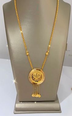 A Turkish coin necklace on 21k gold is a captivating piece of jewelry that combines historical and cultural elements with the luxury of high-purity gold. This necklace typically features an authentic Turkish coin, often an Ottoman or ancient coin, set in a 21k gold bezel or frame. The gold used is 21 karats, which means it's a high-quality and beautifully rich yellow gold. 19.10 grams length 22'' These necklaces are not only a fashion statement but also a nod to Turkish heritage and history. The Cheap Gold Amulet Jewelry, Luxury Antique Gold Pendant Necklace, Arab Gold Coin Jewelry, Turkish Pendant Jewelry, Luxury 22k Gold Byzantine Jewelry, Gold Pendant Jewelry Turkish, Jewelry Gold Turkish, 22k Gold Necklace Pendant, Luxury 22k Gold Necklace