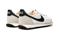 The Nike Waffle Trainer 2 “White/Black” is a versatile, two-tone, white-and-black colorway of retro-infused lifestyle shoe that looks to the brand’s collection of ‘70s-era running shoes for design inspiration.  A successor of sorts to the Nike Waffle Racer, a pioneering track shoe worn by elite runners in the 1970s, the Waffle Trainer 2 in the “Black/White’ colorway features a white nylon base with a contrasting black leather Swoosh on either side.  The design of the Swoosh is reminiscent of the Fashionable Mom Outfits, Waffle Trainer 2, White Sneakers Nike, Nike Waffle Trainer, White Black Shoes, Nike Waffle Racer, Retro Running Shoes, Black And White Nikes, White Nike Shoes