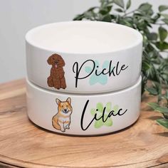 two white bowls with brown dogs on them and the words pickle life written in black