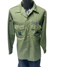 X209 Add me to your Favorites Seller's List Mannequin is a size 38 chest. Features: * Military * patches * Made in Unknown Size: Mens XL Measurements Chest 23 in / 58 cm length 29 in / 74 cm Sleeve 23 in / 58 cm Shoulder 19 in / 48 cm Condition: Pre-Owned Good Article is in excellent condition. Green Long Sleeve Military Style Tops, Retro Khaki Tops With Pockets, Uniform Long Sleeve Cotton Tops, Uniform Style Long Sleeve Cotton Tops, Long Sleeve Cotton Uniform Tops, Cotton Long Sleeve Uniform Tops, Retro Green Top With Pockets, Retro Long Sleeve Khaki Top, Retro Khaki Long Sleeve Top