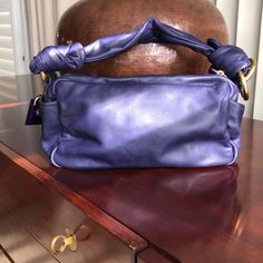 This Is A Really Beautiful Soft Purple Glove Leather Coach Bag. It Was Purchased By Me To Wear With A Particular Dress But Unfortunately I Outgrew The Dress And Never Used The Purse. I’m Trying To Downsize In Anticipation Of A Move And I Have Listed A Large Number Of Things On This Site That I Have Never Worn Or Have Worn Once Or Twice. Some I’ve Listed At Rock-Bottom Price As Others Have A Little More Flexibility. I Will Consider Any Serious Offer For Anything In My Closet. Coach Purple Shoulder Bag For Evening, Coach Purple Evening Bag, Purple Gloves, Rock Bottom, Soft Purple, Purple Leather, Leather Gloves, Brass Color, Coach Bags