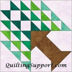 an image of a quilting project with green and brown geometrics on it,