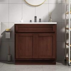 a bathroom with a sink, toilet and shelving unit