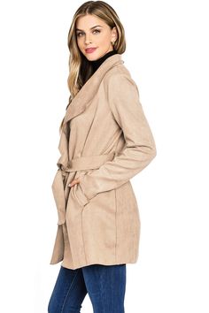 Faux-suede wrap coat with a mid thigh length, trench coat silhouette. Minimal, classic design with oversized draping lapels, slant pockets on the sides and a self-tie belt at the waist. Light weight coat effortlessly layers without looking bulking. CARE | Hand Wash Cold CONTENTS | Shell: 96% Polyester/ 4% Spandex/ Lining: 100% Polyester MEASUREMENTS | 33"/84 cm Top to Bottom MODEL | 5'8 - wearing a size S/M IMPORTED Chic Belted Pea Coat With Lapel Collar, Fall Beige Outerwear With Tie Waist, Chic Beige Wrap Outerwear, Chic Outerwear With Tie Waist And Lapel Collar, Chic Solid Outerwear With Tie Waist, Fall Belted Wrap Outerwear, Fall Outerwear With Tie Waist And Lapel Collar, Fall Wrap-style Belted Outerwear, Belted Wrap Outerwear For Fall