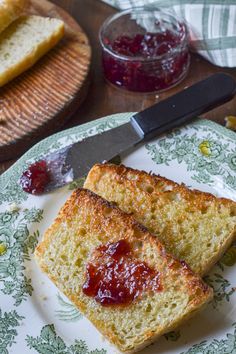 two slices of bread on a plate with jam