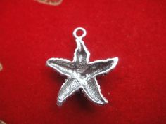 This sterling silver starfish charm measures almost 20x15mm. Perfect for the necklaces, bracelets, and earrings. It is oxidized to show details.1 pc.SHINY VERMEIL VERSIOIN:  Listing: https://www.etsy.com/listing/130272859/vermeil18k-gold-over-925-sterling-silverFor the larger quantity convo us.Thanks for stopping by! Silver Starfish Charm Jewelry, Silver Starfish Charm For Jewelry Making, Silver Jewelry With Starfish Charm For Jewelry Making, Silver Starfish Charm For Gifts, Silver Starfish Charm As Gift, Silver Starfish Charm For Gift, Starfish, Charms, 925 Sterling Silver